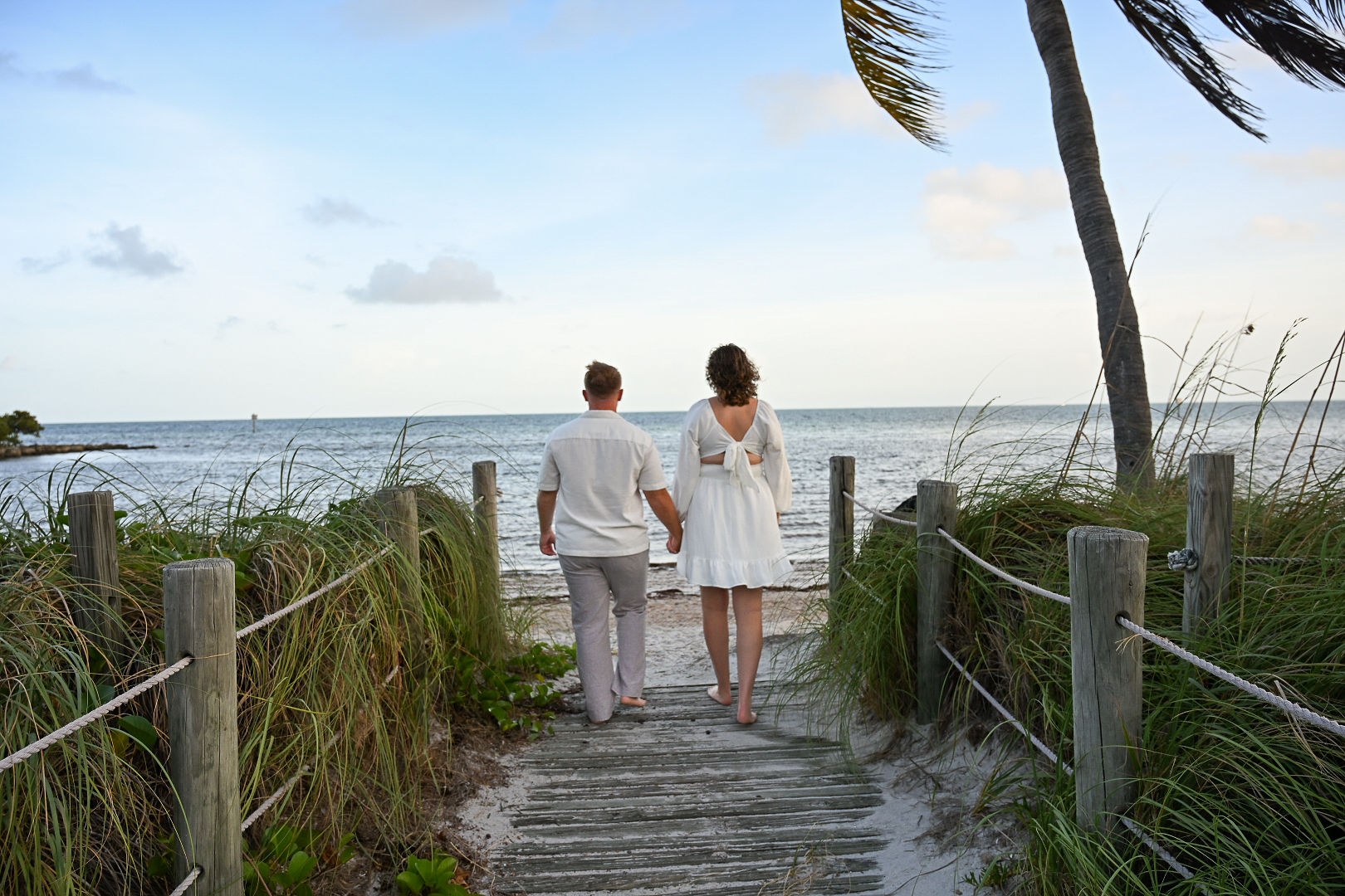Couple walking together toward the water