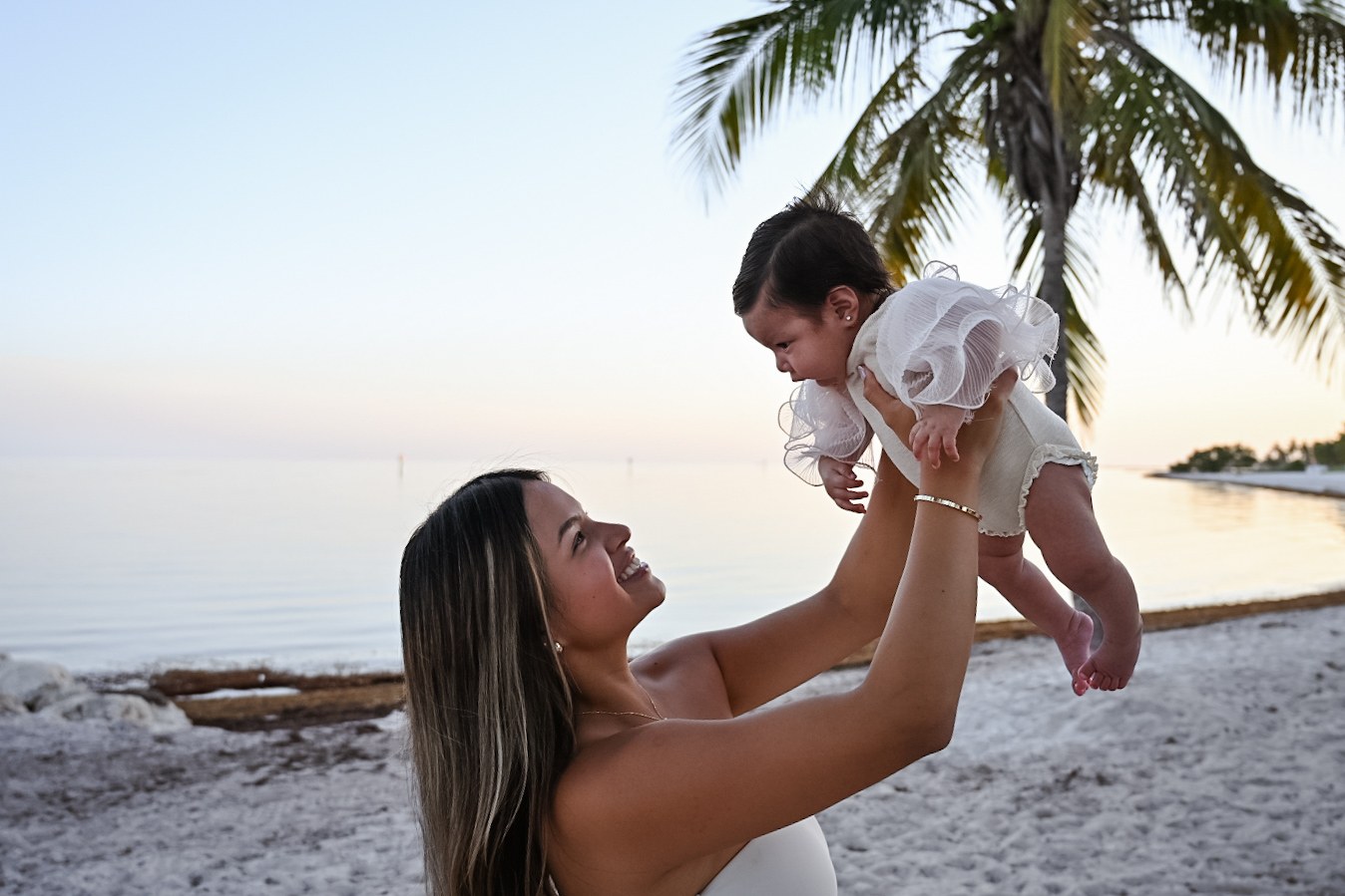 Mother lifting her baby during a Key West family session