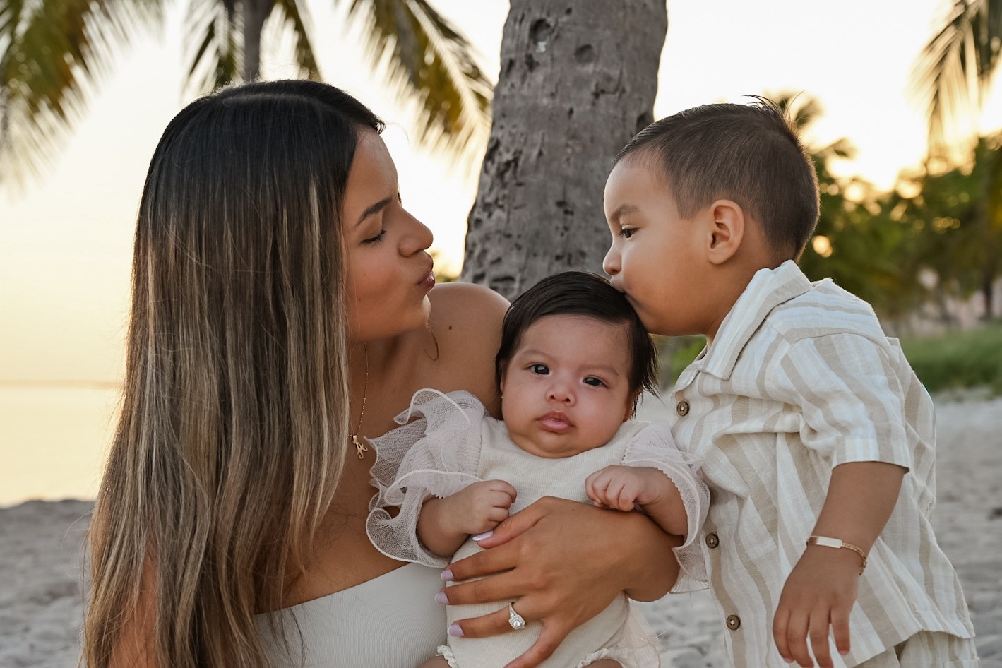 Mother holding her children during a Key West family session
